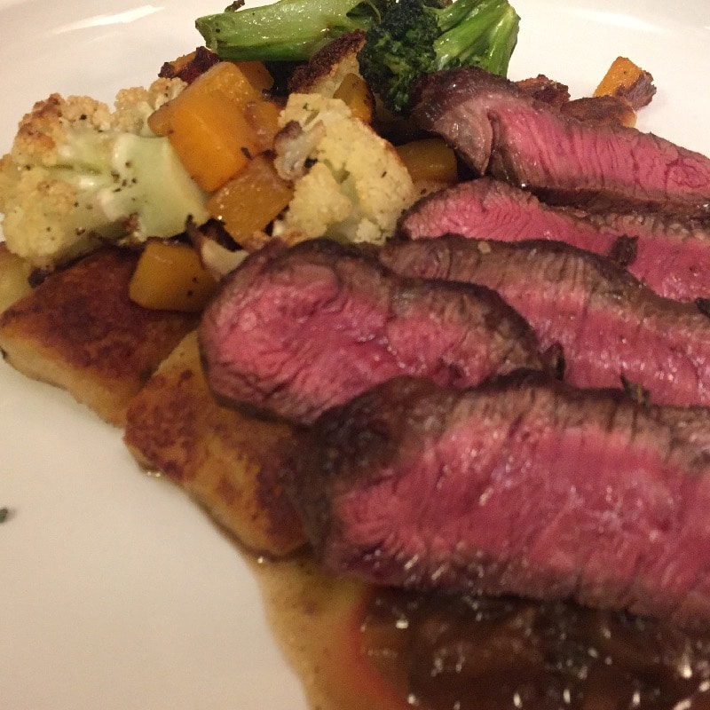flat iron steak with gnocchi and vegetables 