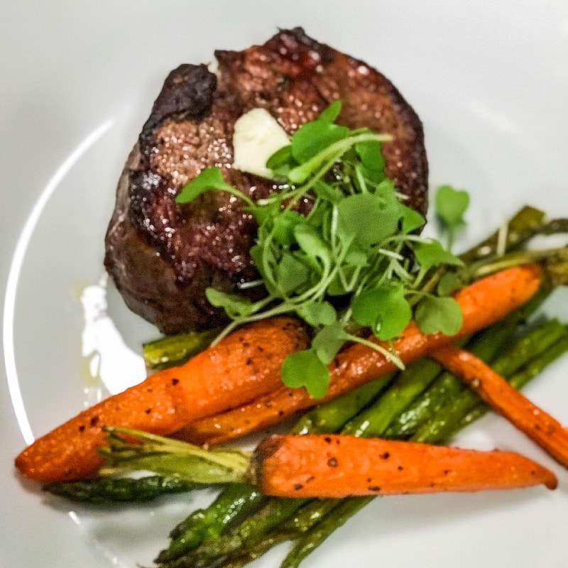 Filet mignon with compound butter and roasted vegetables