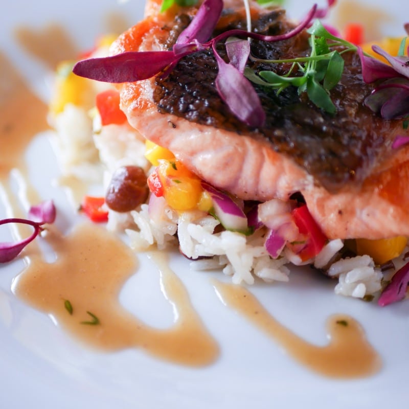 Maple glazed salmon with rice and peas and mango salsa