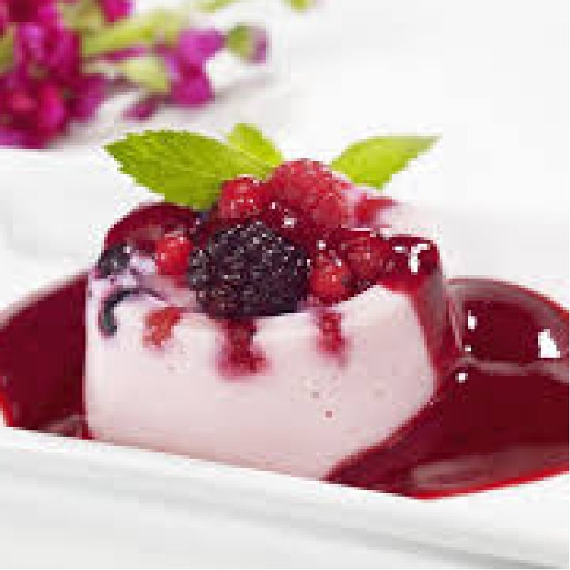 Italian Vanilla Bean Panna Cotta with a triple berry sauce