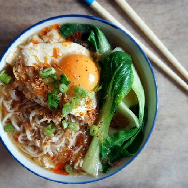 Miso ramen soup with pak choi, poached egg, and crispy shallots