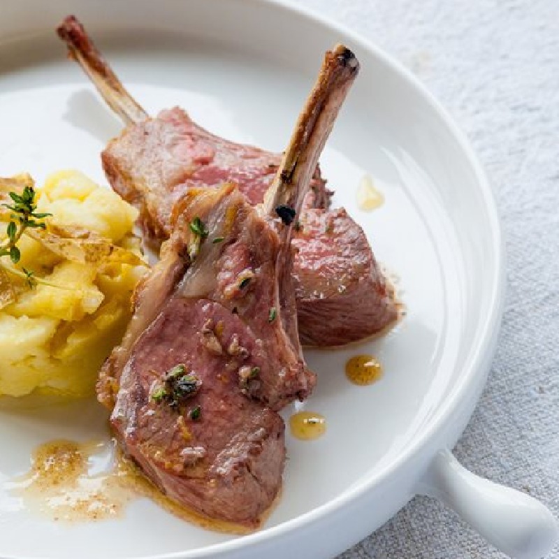 Grilled rack of lamb with crushed Jersey Royals and anchovy butter