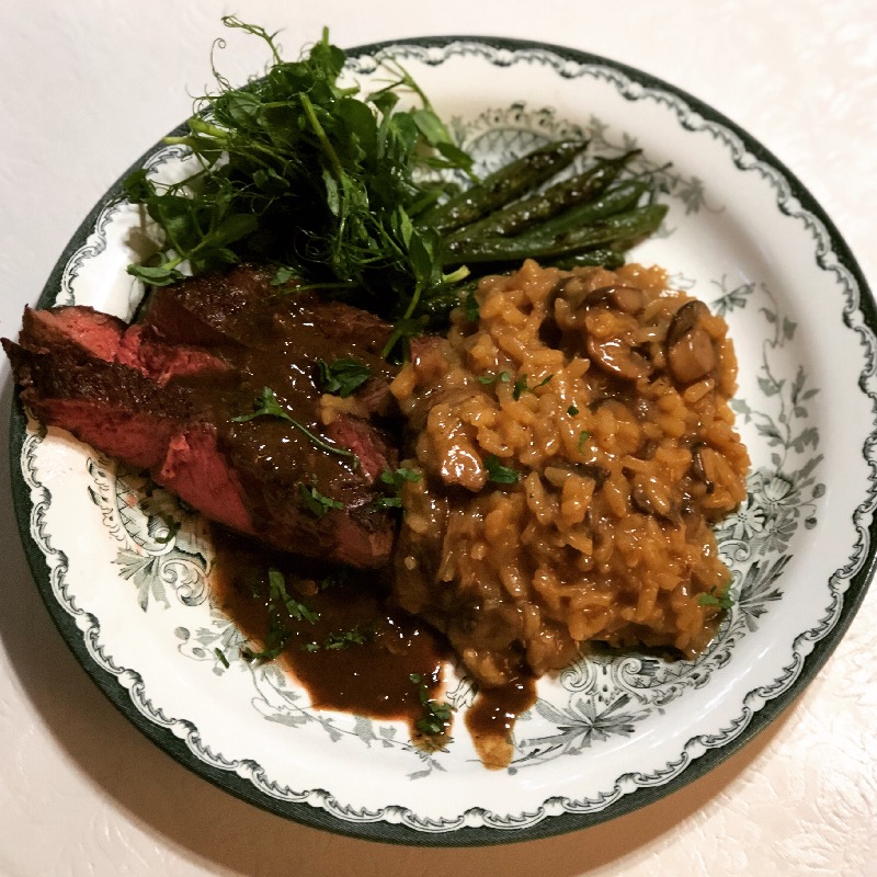 Rib steak, mushroom risotto, haricot verts & pea shoot salad