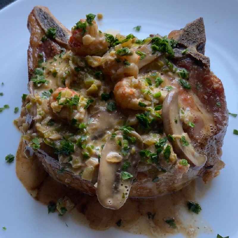 Pork Chop with Crawfish and Mushroom Cream Sauce