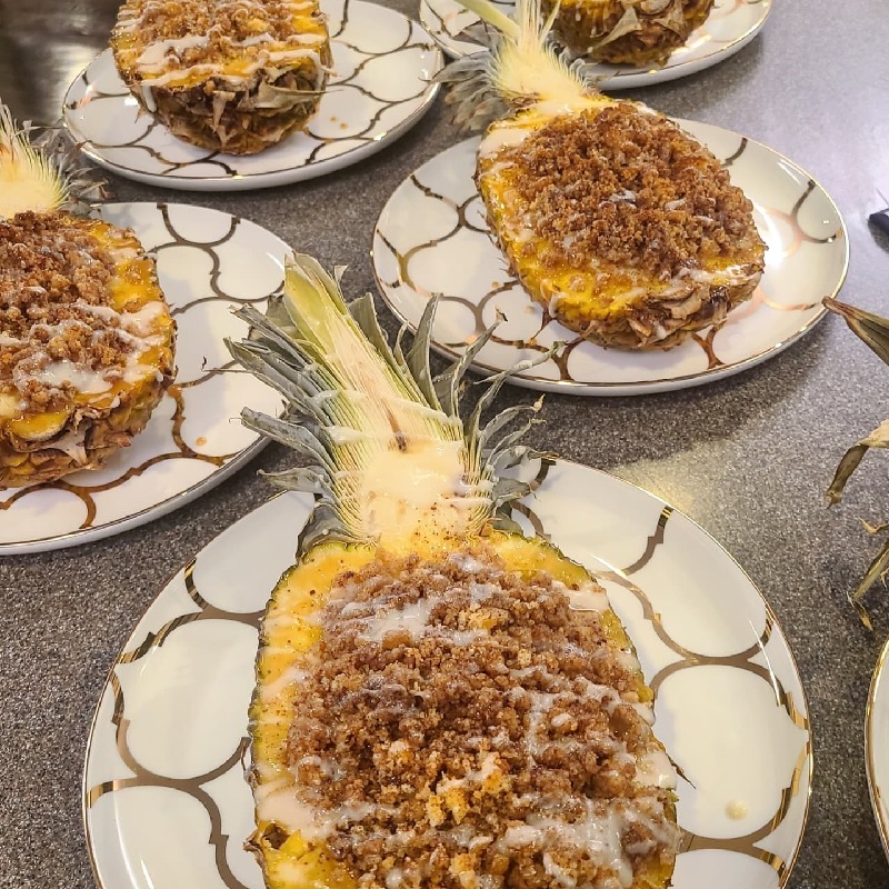 Pinneapple Upside Down Cheesecake baked inside Pinneapple 