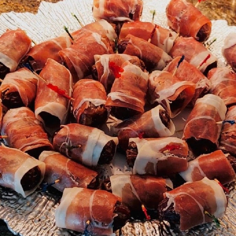 Stuffed dates wrapped in Prosciutto