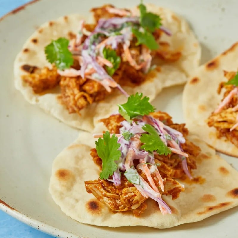 Spicy pulled chicken and slaw tacos